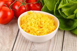 Shredded cheese in the bowl photo