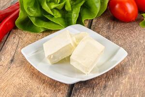 Greek traditional Feta cheese in the plate photo