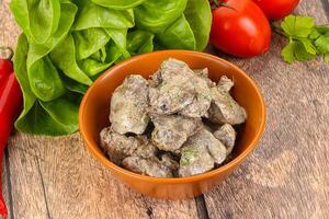 Chicken liver with cream sauce photo