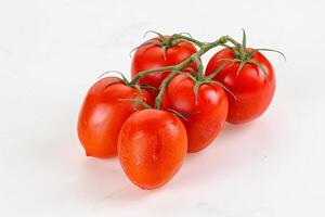 Raw red Flamenco tomato branch photo