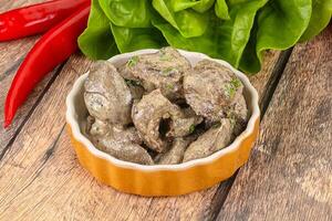 Chicken liver with cream sauce photo