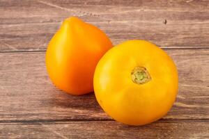 Ripe yellow bright juicy tomato photo