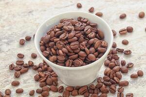 Roasted coffee bean in the bowl photo