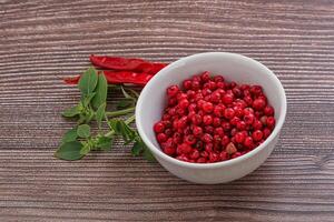 Red pepper seeds in the bowl photo