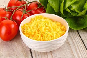 Shredded cheese in the bowl photo