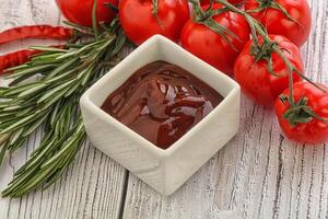 Tomato barbecue sauce on the bowl photo