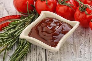 Tomato barbecue sauce on the bowl photo