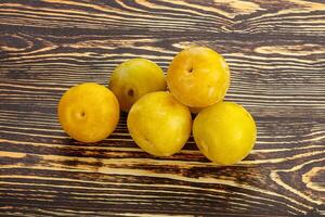 Yellow sweet plum heap fruit photo