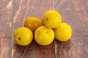 Yellow sweet plum heap fruit photo