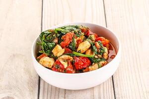 Chicken with tomato and spinach photo