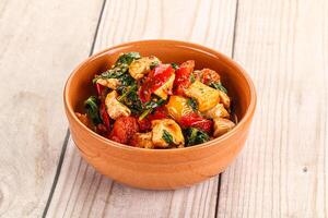 Chicken with tomato and spinach photo