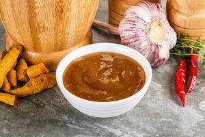 Indian curry sauce in the bowl photo