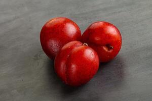 Ripe sweet juicy red plum photo