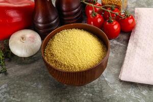 Raw dry wheat couscous grain photo