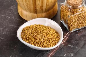 Mustard dry seeds in the bowl photo