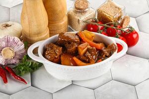 Homemade beef hungarian goulash with potato photo