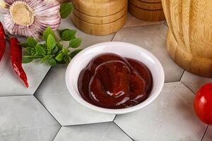 Tasty barbecue sauce in the bowl photo
