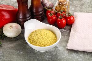 Raw dry wheat couscous grain photo