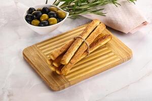 Crispy grissini italian bread heap photo