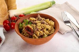 Bulgur with lamb and vegetables photo