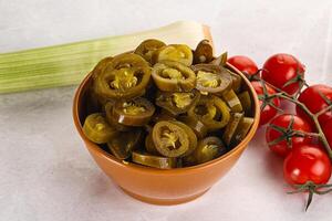 Sliced canned jalapeno pepper photo