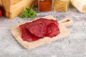 Smoked beef meat - Pastrami slices photo