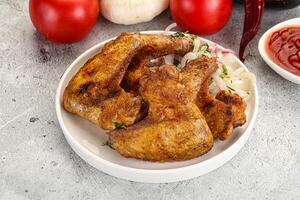 Grilled chicken wings with sauce photo