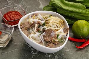 Vietnamese soup Pho Bo with beef photo