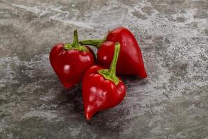 Red spicy cherry pepper heap photo