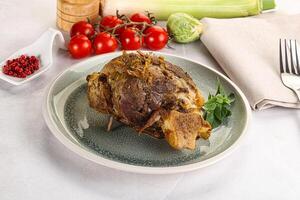 Baked Lamb shank with bone photo