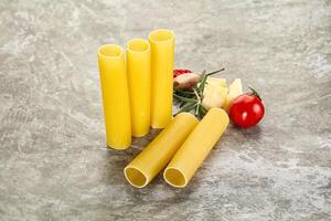 Raw uncooked Italian pasta Cannelloni photo