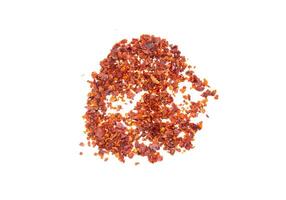 Chilli pepper flakes isolated on a white background. Top view, flat lay. photo