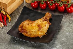 Roasted chicken leg with spices photo