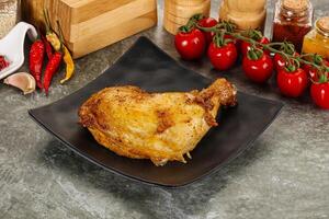 Roasted chicken leg with spices photo