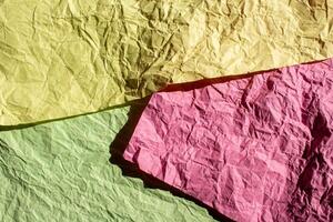 Crumpled colorful paper texture background photo