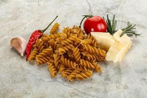 Raw whole grain pasta fusilli photo