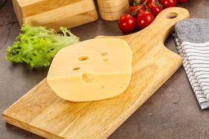 Gourmet Maasdam cheese with hole photo