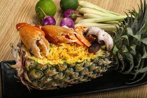 Rice with seafood in pineapple photo