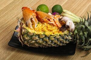 Rice with seafood in pineapple photo