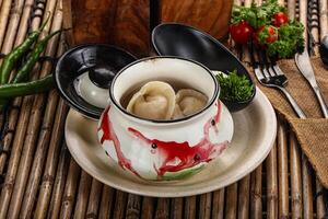 Russian siberian dumplings Pelmeni with meat photo