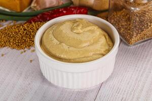 Dijon mustard sauce in the bowl photo