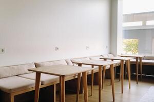 Tables standing in the interior. Places to sit in a cafe photo