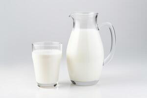 Closeup of natural whole milk in jug and glass photo