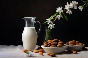 Almond milk with almond and green twig accents. photo