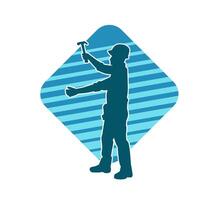 Silhouette of a worker carrying hammer tool. Silhouette of a worker in action pose using hammer tool. vector
