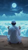 AI generated Rear view of a Muslim man sitting while raised hands and praying in the land above the cloud praying to Allah photo