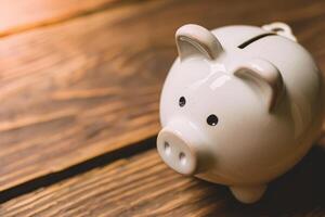 AI generated piggy bank on old wood table photo