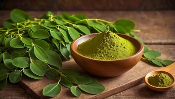 ai generado moringa polvo en de madera bol, Fresco hojas foto