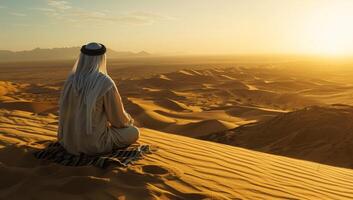 AI generated Arabian man meditating in desert at sunset photo