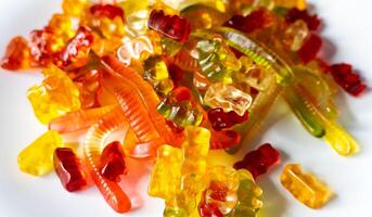 Jelly gummy bears and snakes Colorful fruit gum candies photo